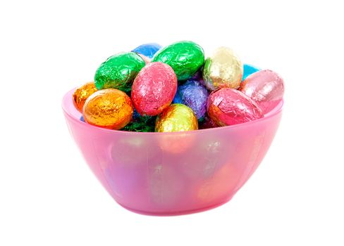 pink bowl with colorful easter eggs over white background