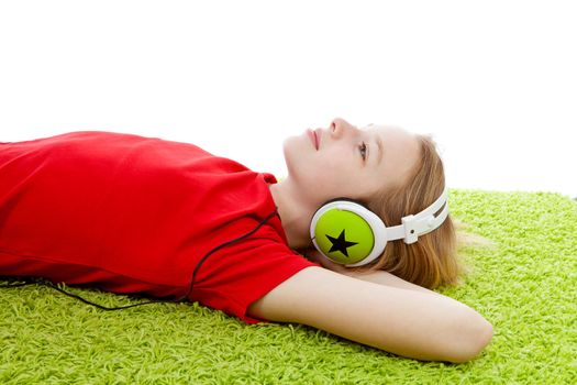girl is listening to music with headphones on over white background