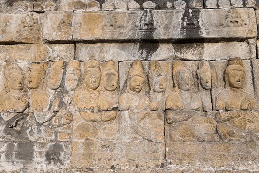 Detail of Buddhist carved relief at Borobudur temple on Java, Indonesia