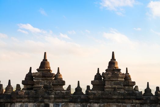 Wall with small stupas on the top level of  Borobudur, or Barabudur, temple Jogjakarta, Java, Indonesia at sunrise. It is a 9th-century Mahayana temple and the biggest  Buddhist Temple in Indonesia.