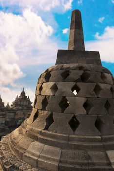 Stupa with hidden Buddha statue inside in Borobudur, or Barabudur, temple Jogjakarta, Java, Indonesia at sunrise. It is a 9th-century Mahayana temple and the biggest  Buddhist Temple in Indonesia.