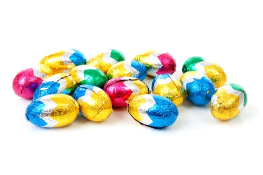 Pile of colorful easter eggs over white background