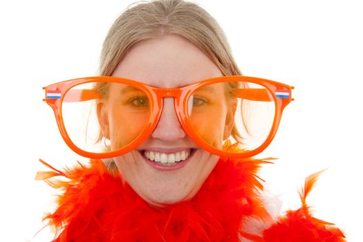 portrait of a soccer supporter with big orange glasses over white background