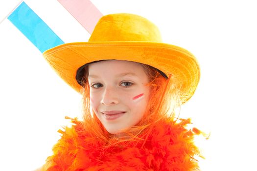 Dutch young girl dressed up as soccer supporter or queensday is pointing over white background