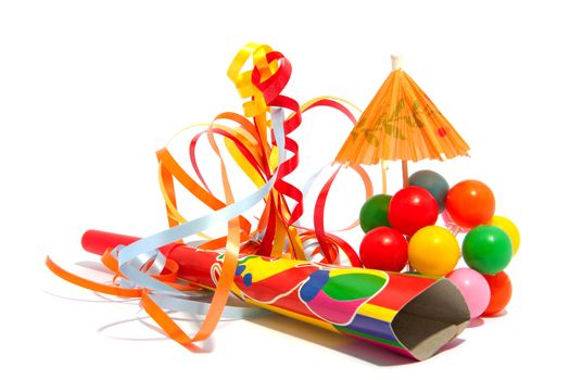 colorful party accessories with streamers over white background