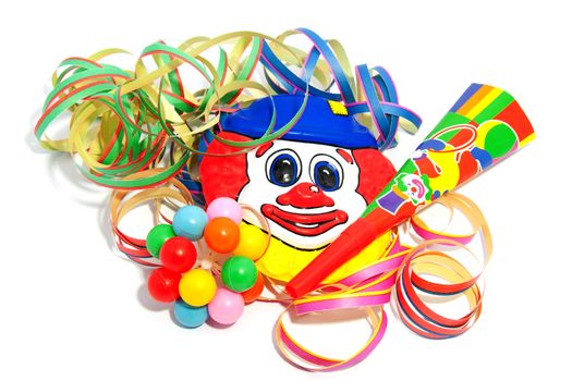 colorful party accessories with streamers over white background