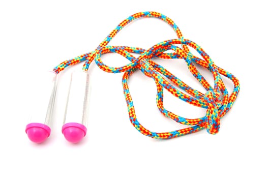 colorful jumping rope in closeup over white background