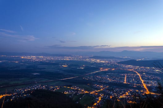 Panoramic night view on Ljubljana from top of Smarna mountain.