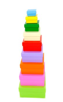 stacked colorful packaging boxes isolated on white background 
