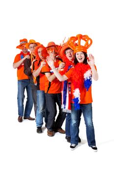 Group of orange Dutch soccer fans over white background