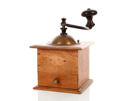 Old wooden coffee grinder over white background
