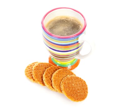 Cup of coffee and syrup cookies over white background