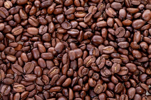 Background of roasted coffee beans in closeup