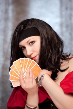 Portrait of gypsy woman with cards