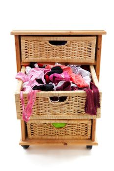 closed  trays filled with sexy lingerie over white background