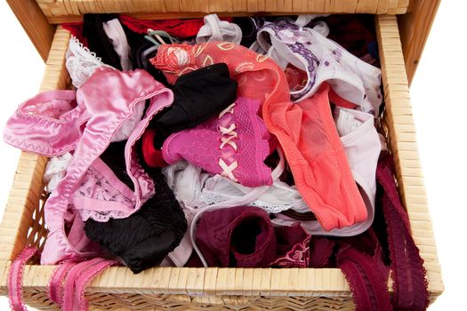 closed tray filled with sexy lingerie over white background