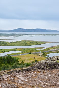 Icelandic landscape with mountains and the lake. Nature reserve on the background, Iceland