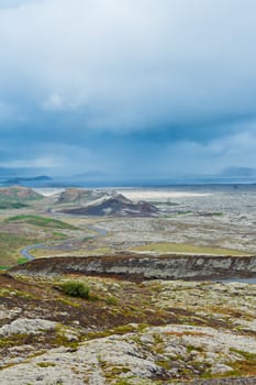 Icelandic landscape with mountains and the road. Nature reserve on the background, Iceland