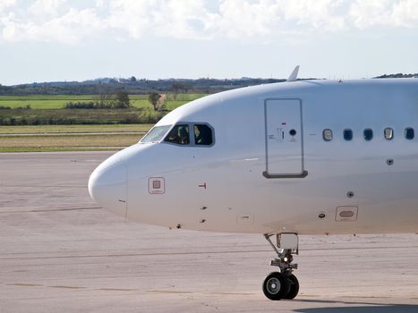 passenger aircraft on airport preparing for takeoff