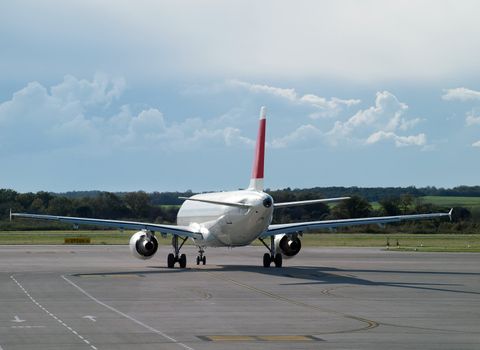 jet airliner taxiing on airport runway