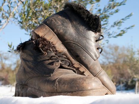 old woman's shoes on the snow