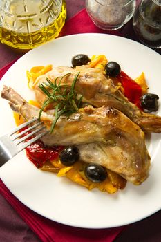 Baked rabbit with olives and pepper