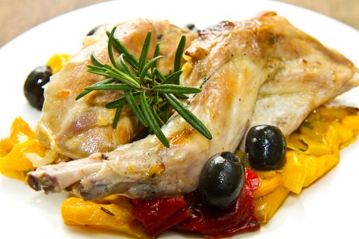 Baked rabbit with olives and pepper