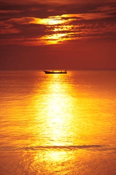 a boat on the sea at sunset in thailand