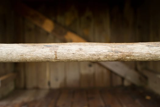 a length of wood inside a wooden structure