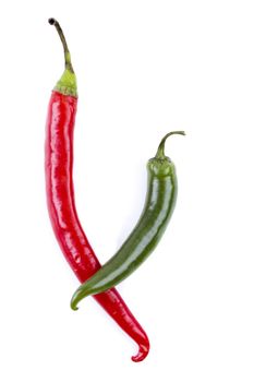 Red and green chili peppers on white background