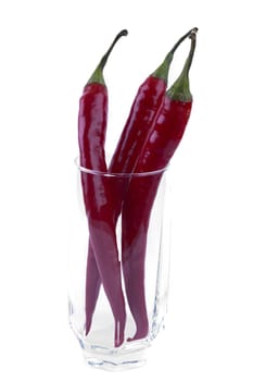 isolated pack of red chili peppers in a glass