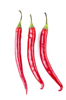a series of three chili peppers vertical
