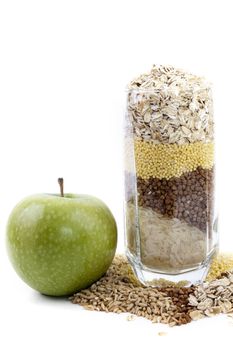 isolated set of cereals in glass and apple