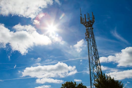 Mobile phone mast with a blue sky behind