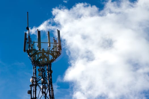 Mobile phone mast with a blue sky behind