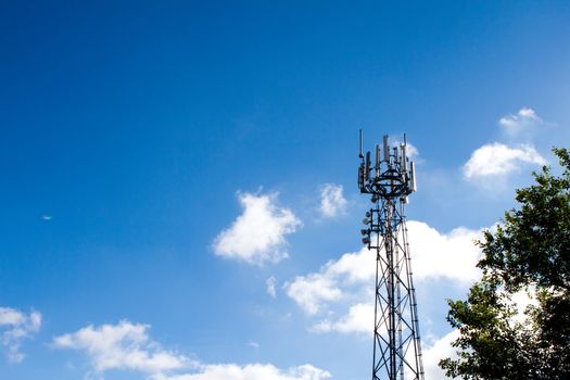 Mobile phone mast with a blue sky behind