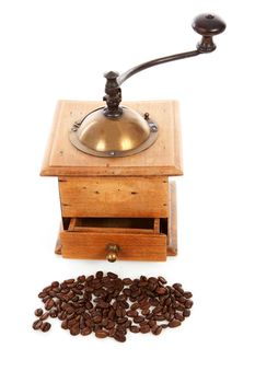 Old wooden coffee grinder over white background
