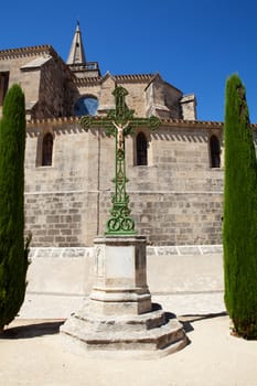 Typical French church with cross against blue sky