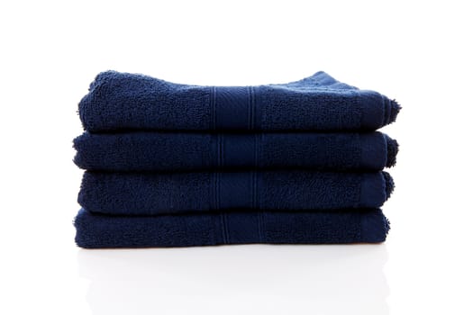 pile of blue towels over white background