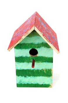 Colorful birdhouse painted by children over white background