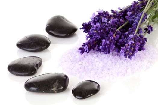 black pebbles stones and lavender flowers over white background