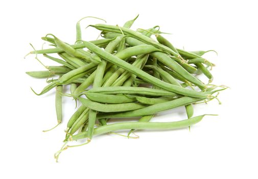 raw long green beans over white background 

