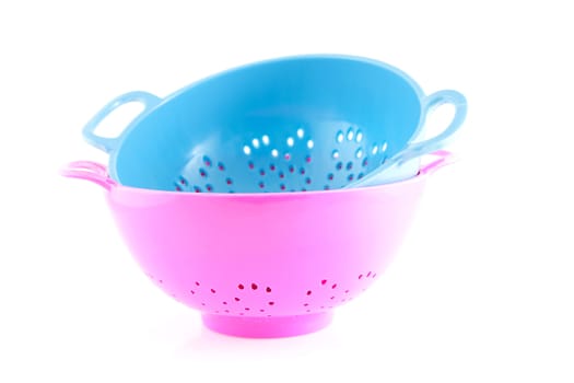 two empty colorful colander isolated on white background
