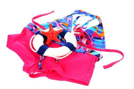 fashion; colorful girls bikini and beach accessories over white background