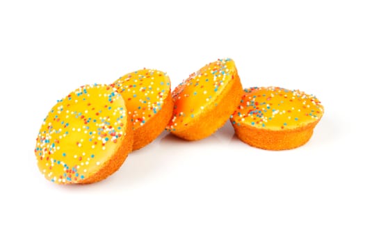 Four orange cake cookies for Dutch soccer with confetti over white background