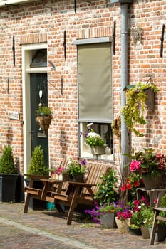 Typical Dutch house in Elburg with flowers