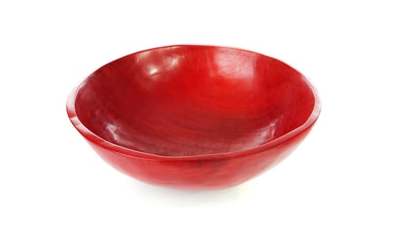 Handmade wooden red African bowl over white background