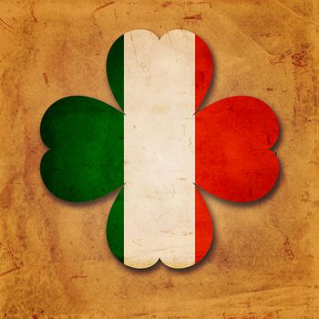 vintage Irish flag in shamrock over old paper background