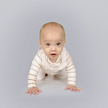 Cute baby boy in white clothing