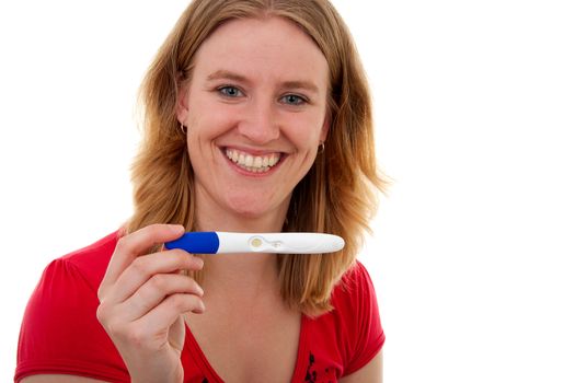 Woman with pregnancy tast is smiling because she is pregnant, over white background